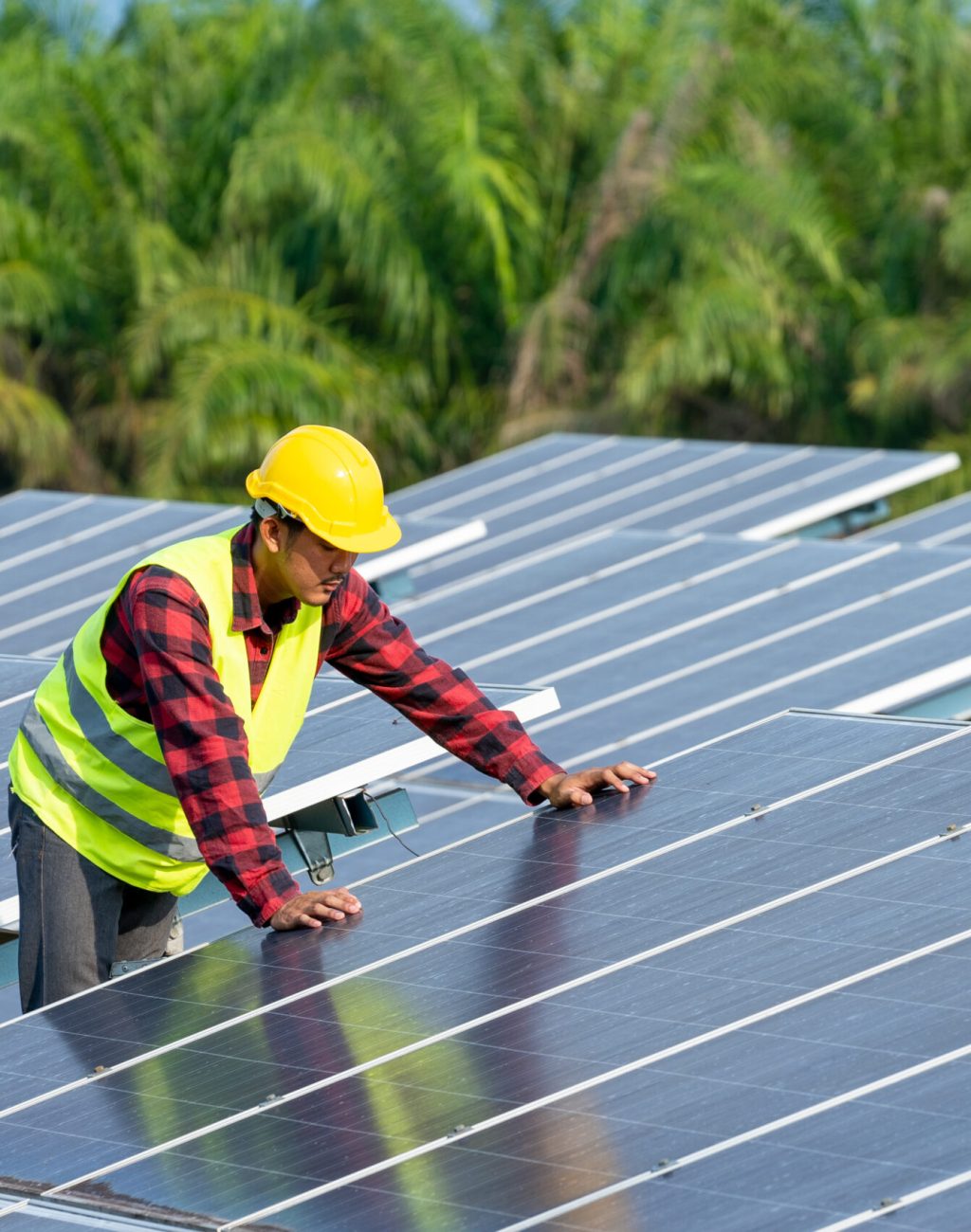 Engineer working on checking equipment in solar power plant,Climate change and renewable energy concept.